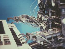 Robotic arm with intricate wiring playing piano, symbolizing the fusion of music and machine learning.